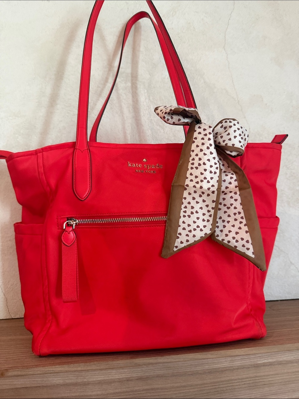 kate spade red tote with heart-print scarf
